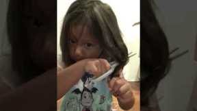 Adorable five year old caught cutting her own hair